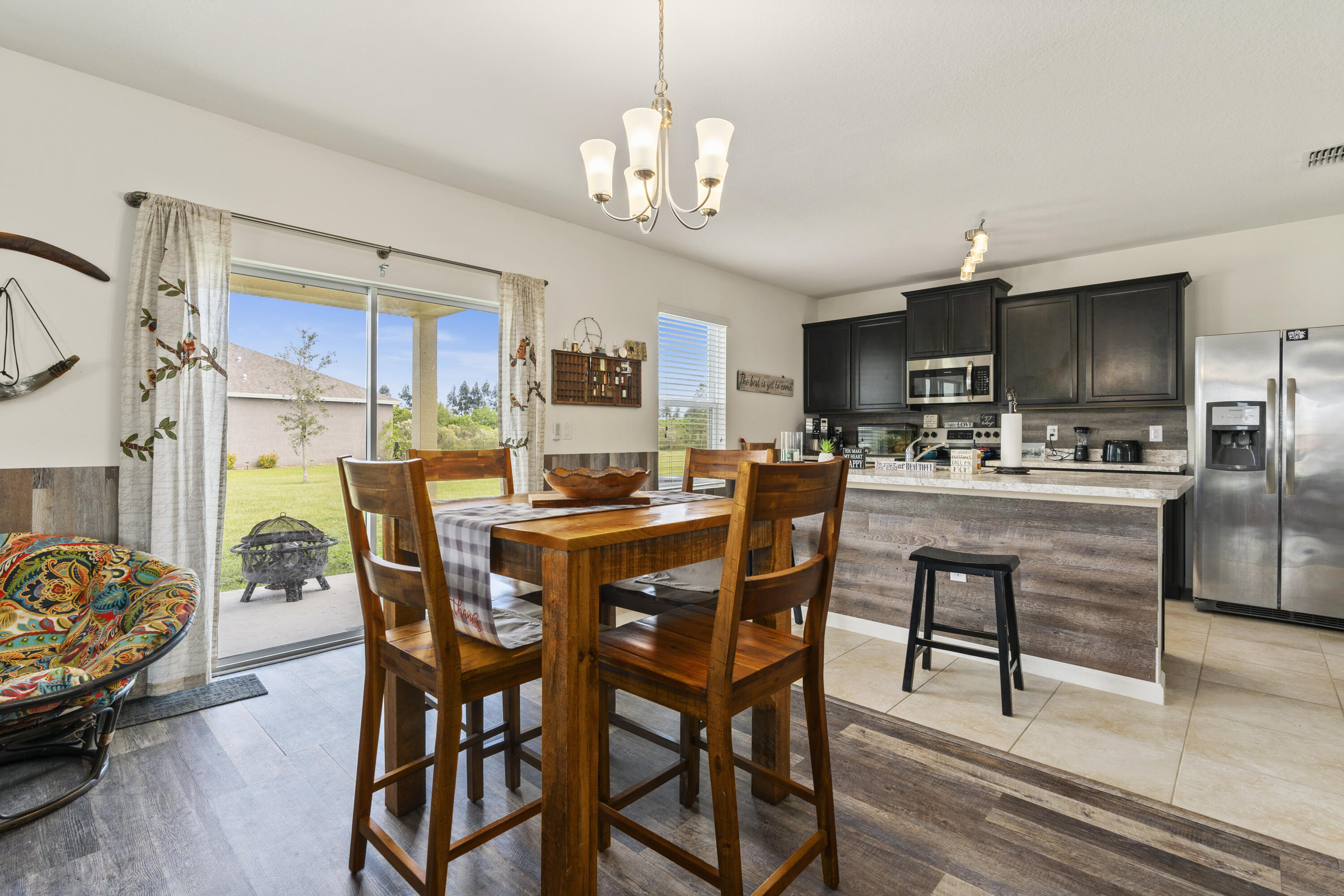 3100 Yellowstone Circle Fort Pierce, FL 34945 - Photo 6 of 28 a view of a dining room with furniture and a chandelier