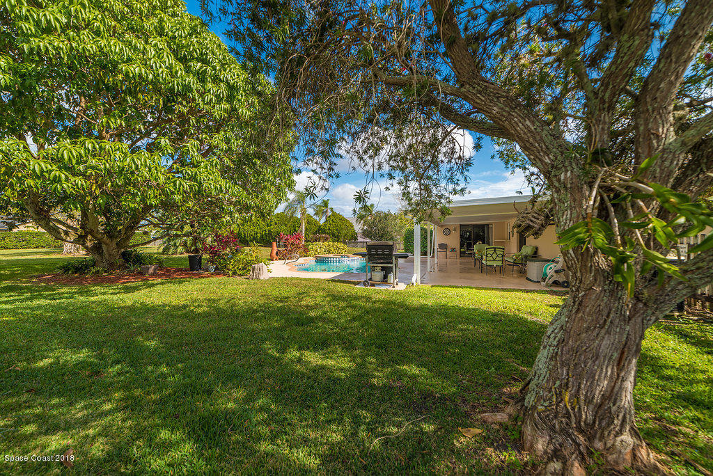 700 Montclair Road Northeast Palm Bay, FL 32905 - Photo 15 of 46 a view of house with outdoor space and garden