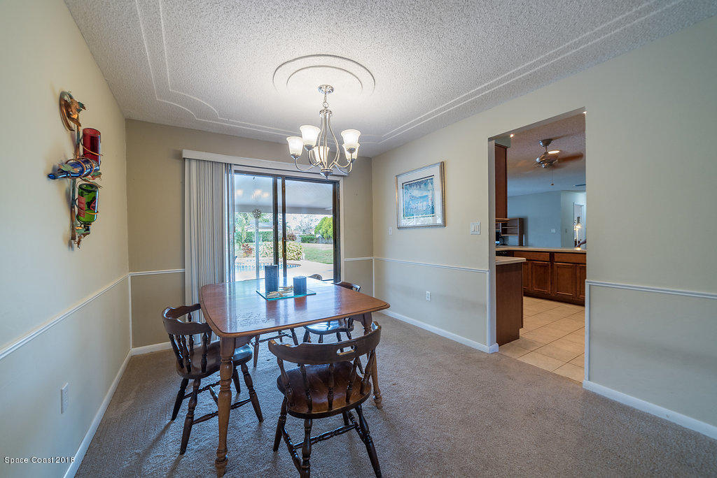 700 Montclair Road Northeast Palm Bay, FL 32905 - Photo 27 of 46 a dining room with furniture and window