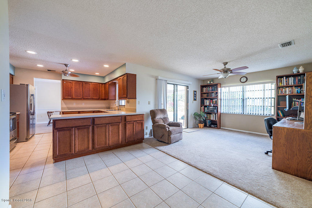 700 Montclair Road Northeast Palm Bay, FL 32905 - Photo 29 of 46 a large living room with a large window