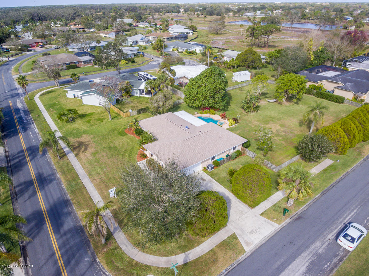 700 Montclair Road Northeast Palm Bay, FL 32905 - Photo 4 of 46 an aerial view of residential houses with outdoor space