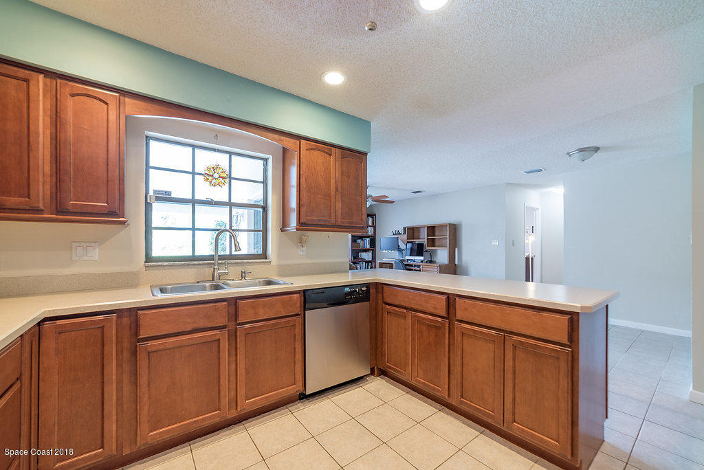 700 Montclair Road Northeast Palm Bay, FL 32905 - Photo 35 of 46 a kitchen with sink and window