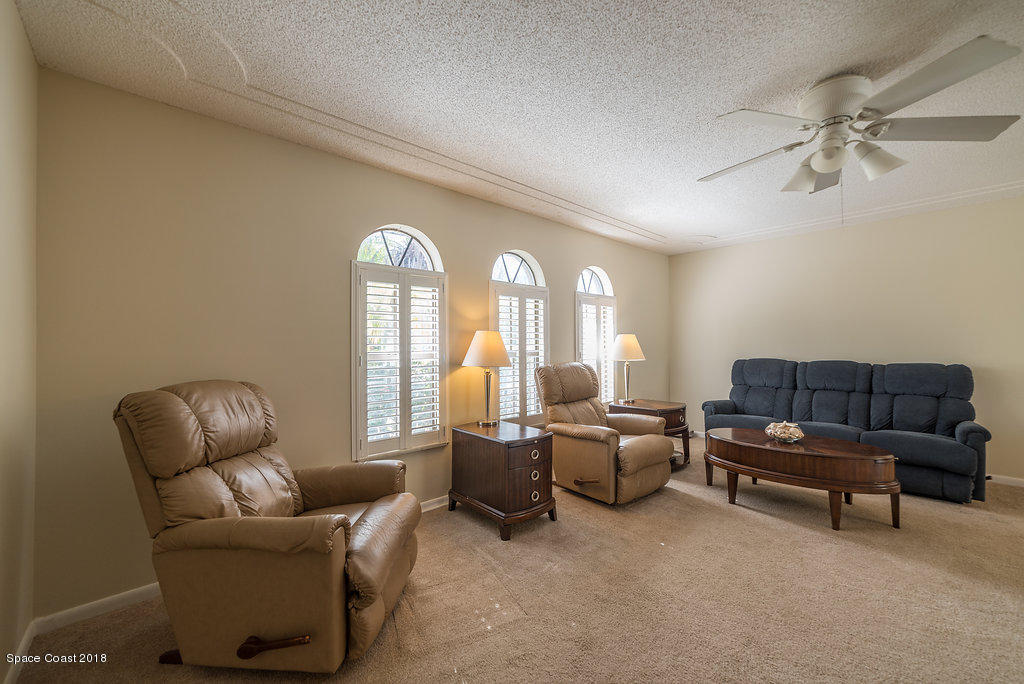 700 Montclair Road Northeast Palm Bay, FL 32905 - Photo 37 of 46 a living room with furniture and a window