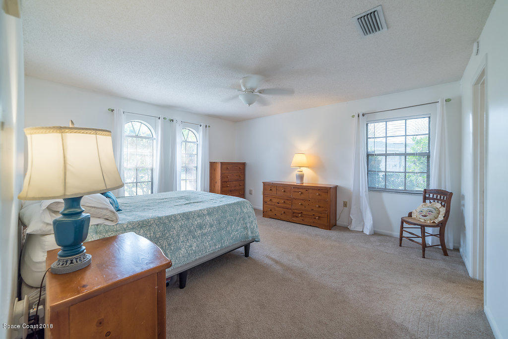 700 Montclair Road Northeast Palm Bay, FL 32905 - Photo 40 of 46 a living room with furniture and a window
