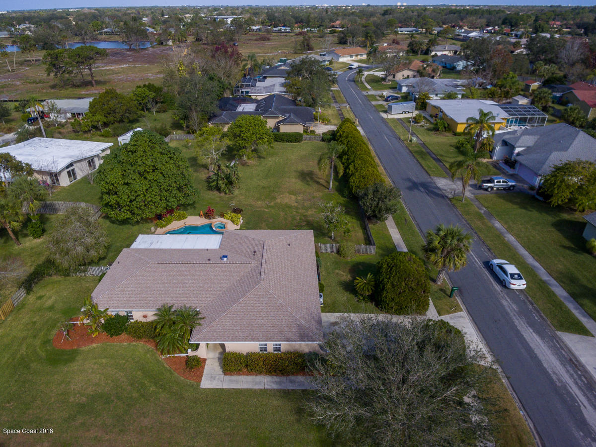 700 Montclair Road Northeast Palm Bay, FL 32905 - Photo 43 of 46 an aerial view of a house with a garden