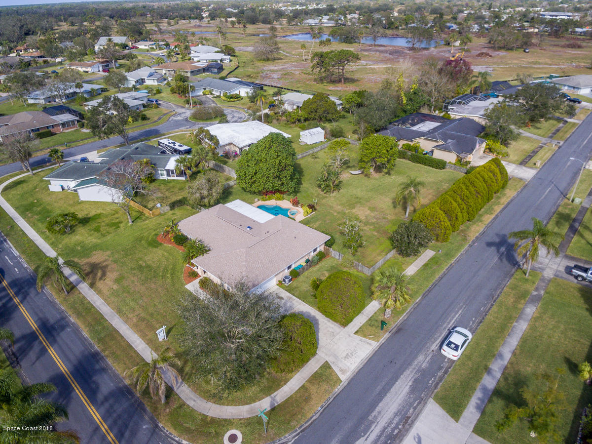 700 Montclair Road Northeast Palm Bay, FL 32905 - Photo 45 of 46 an aerial view of residential houses with outdoor space