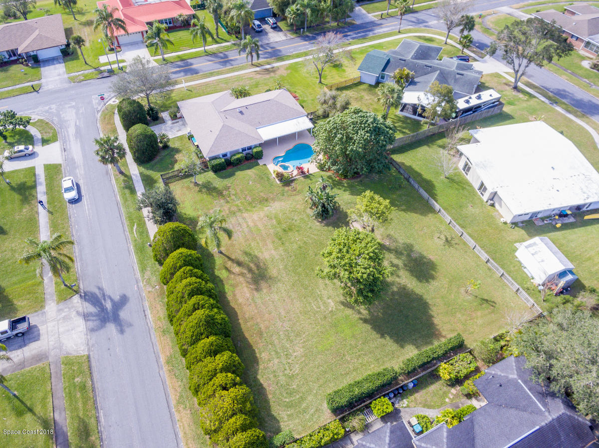 700 Montclair Road Northeast Palm Bay, FL 32905 - Photo 46 of 46 an aerial view of swimming pool patio swimming pool and outdoor seating