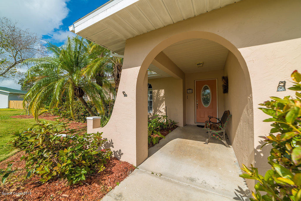 700 Montclair Road Northeast Palm Bay, FL 32905 - Photo 8 of 46 a front view of a house with a yard