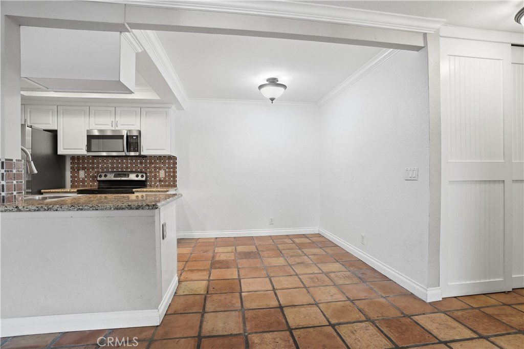 20702 El Toro Road, Unit 231 Lake Forest, CA 92630 - Photo 19 of 36 a view of a kitchen with electric appliances