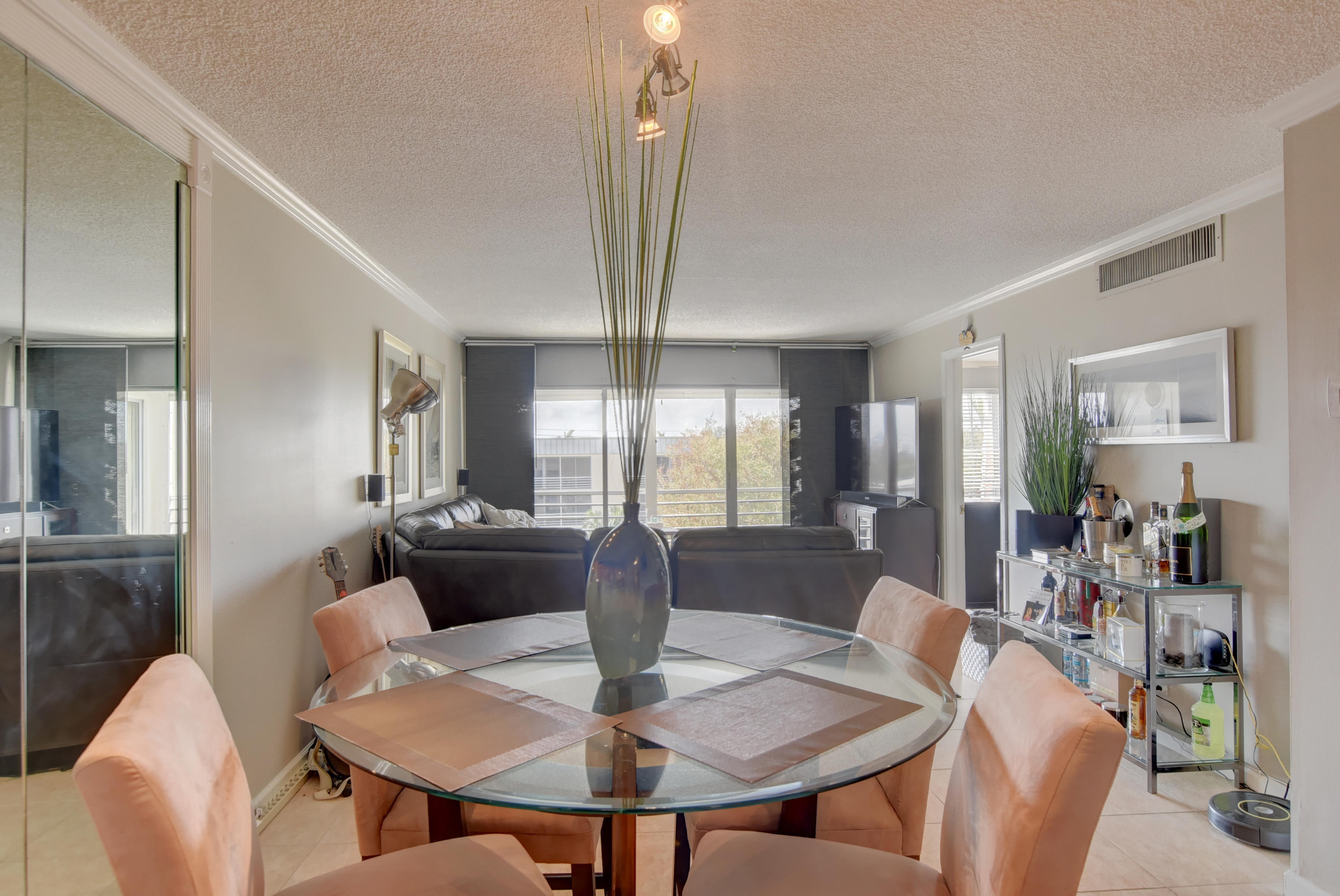 765 Jeffery Street, Unit 1306 Boca Raton, FL 33487 - Photo 12 of 34 a view of a dining room with furniture and wooden floor
