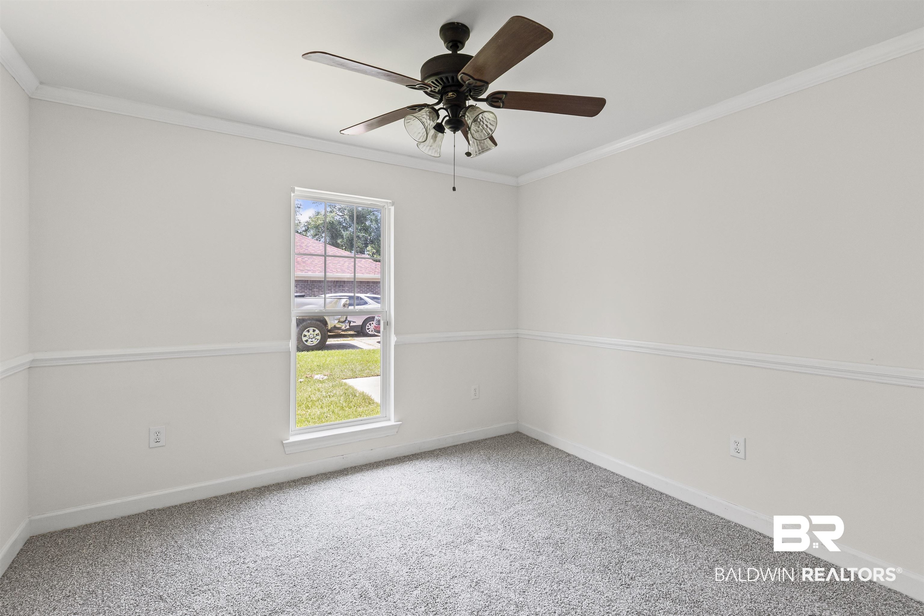 924 Brady Road North Bay Minette, AL 36507 - Photo 17 of 26 Unfurnished room with crown molding, carpet, and ceiling fan