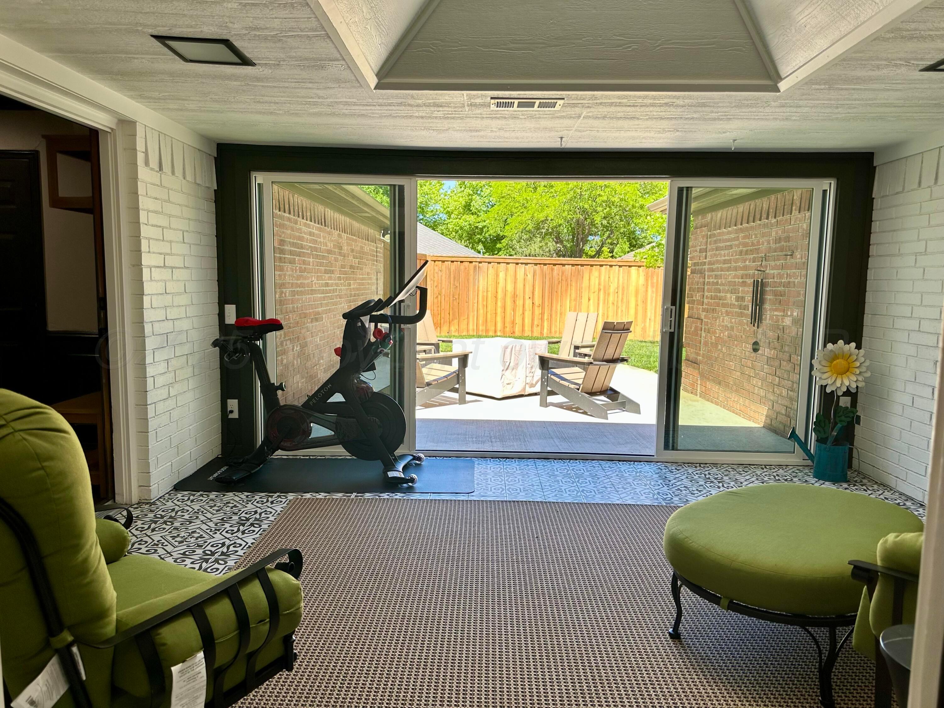 7714 Baughman Drive Amarillo, TX 79121 - Photo 19 of 37 a living room with furniture and a large window