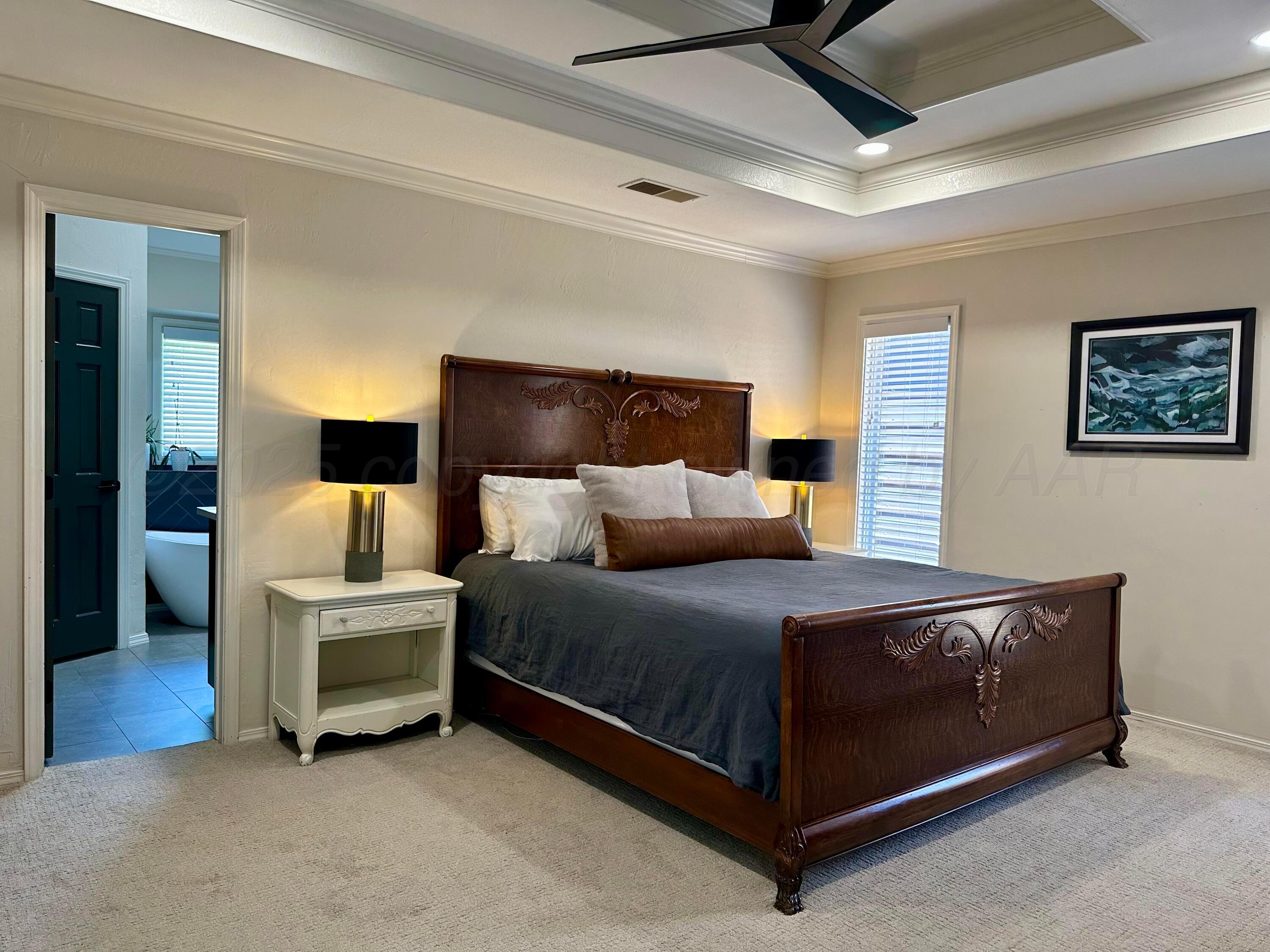 7714 Baughman Drive Amarillo, TX 79121 - Photo 20 of 37 a bed room with a bed and a chair