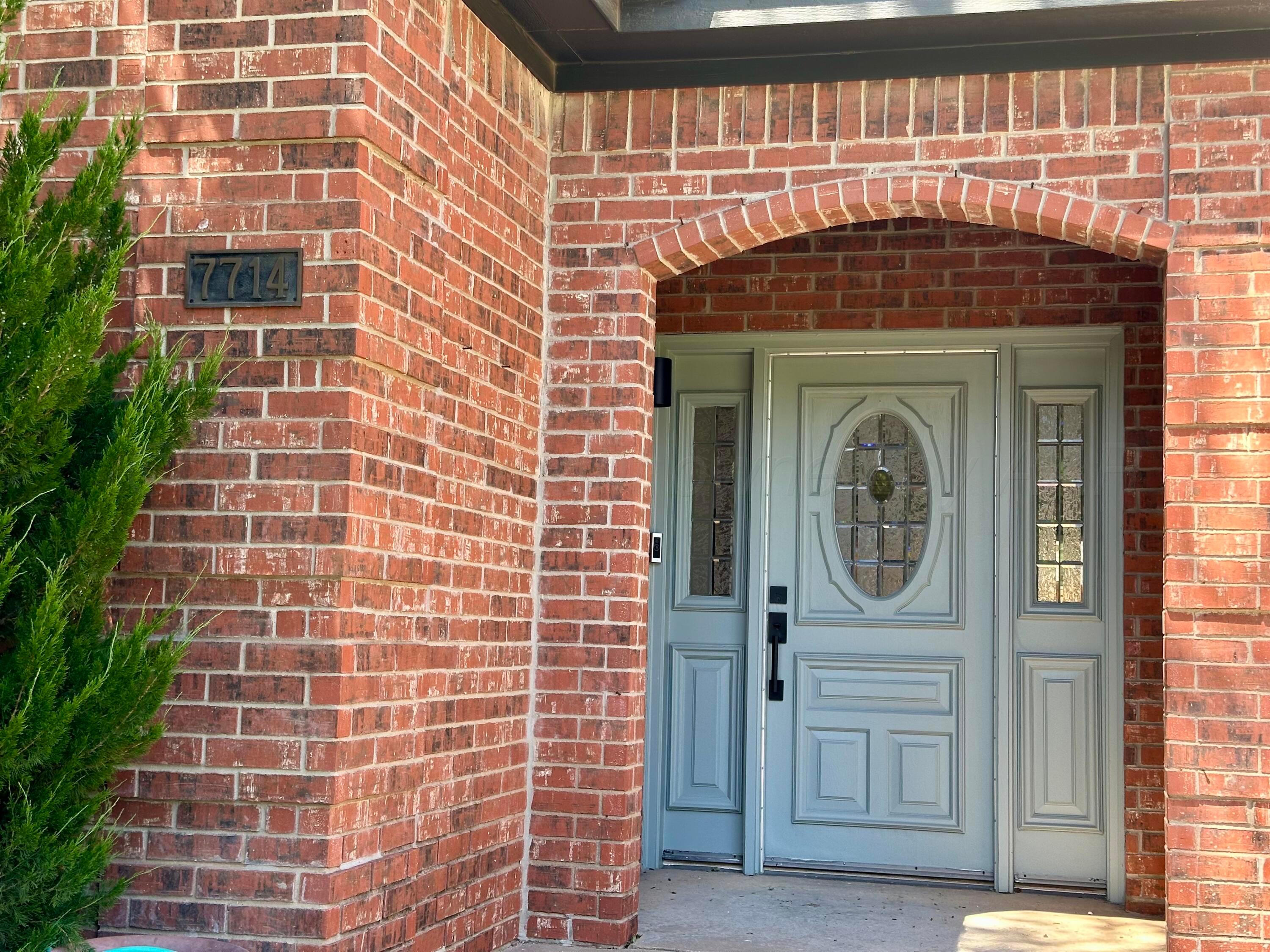 7714 Baughman Drive Amarillo, TX 79121 - Photo 2 of 37 a front view of a building with a door