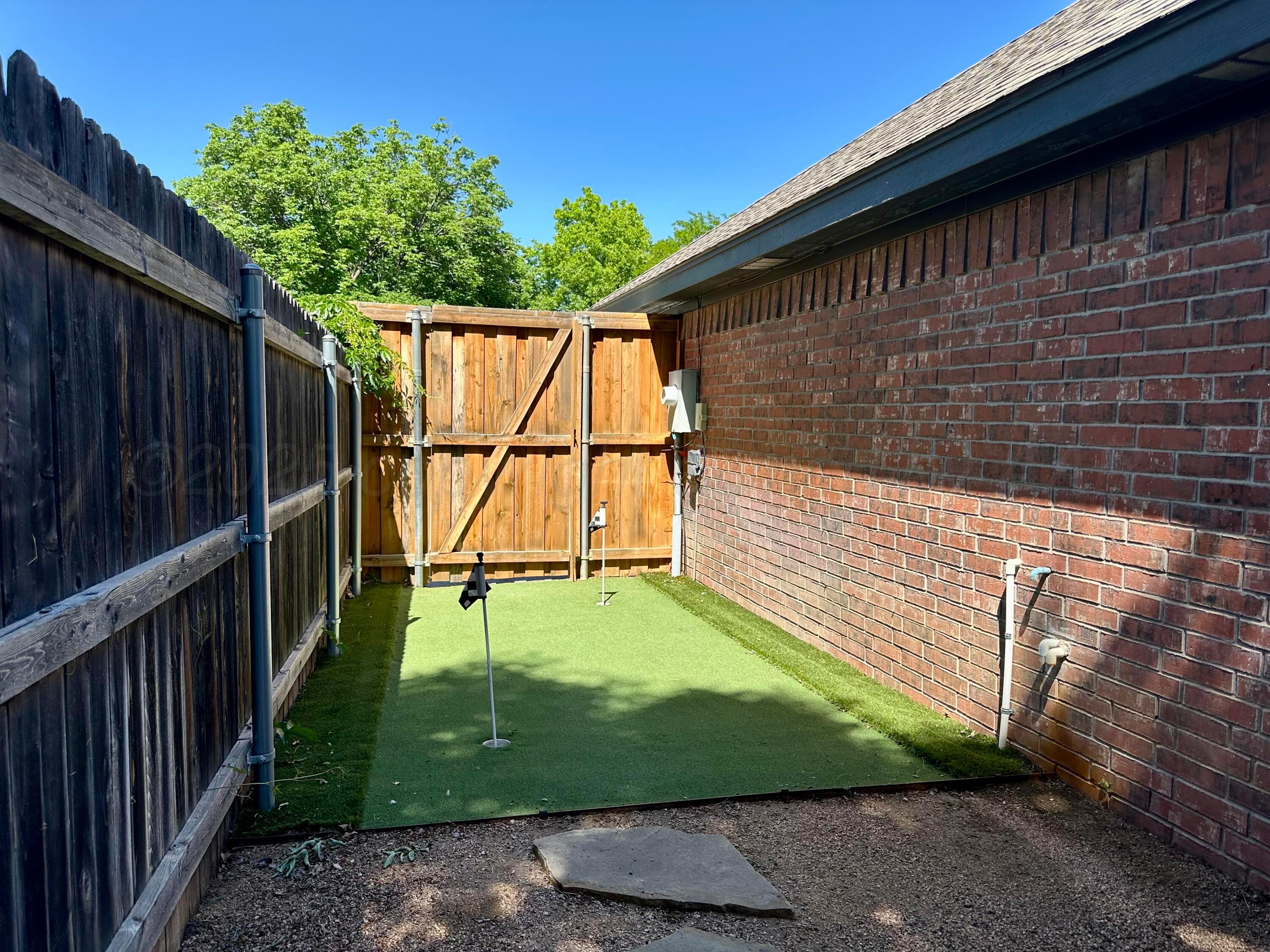 7714 Baughman Drive Amarillo, TX 79121 - Photo 36 of 37 a view of a backyard with stairs