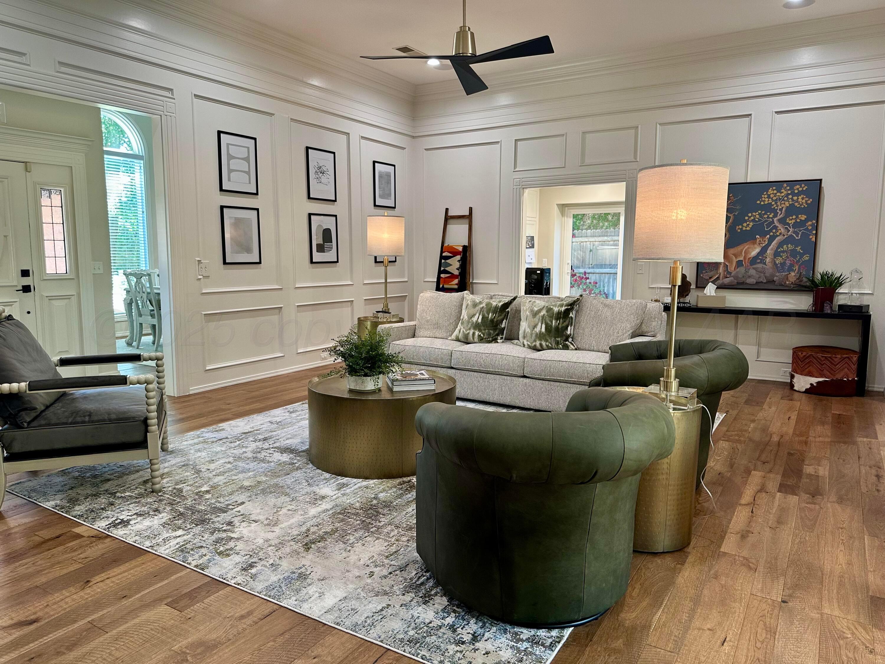 7714 Baughman Drive Amarillo, TX 79121 - Photo 4 of 37 a living room with furniture and a wooden floor