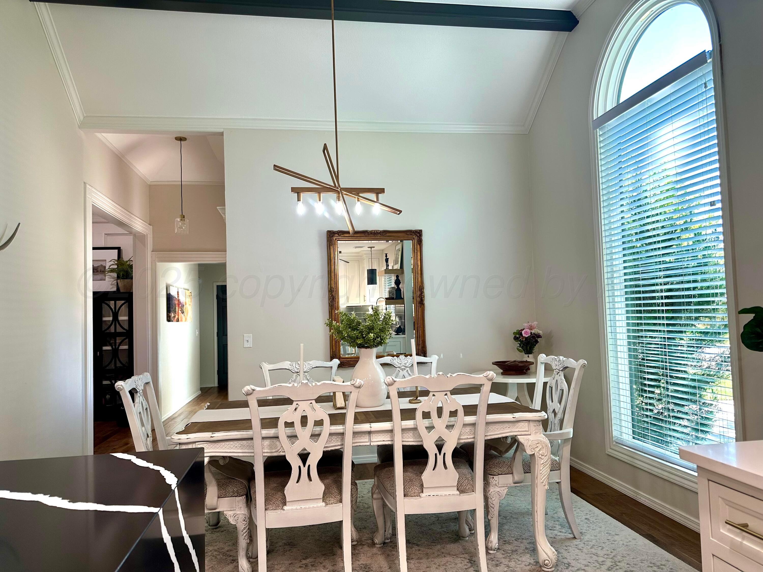 7714 Baughman Drive Amarillo, TX 79121 - Photo 10 of 37 a view of a dining room with furniture window and wooden floor
