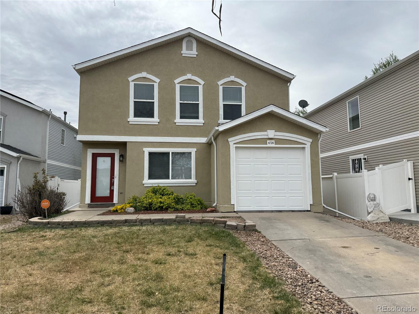 4726 Andes Street Denver, CO 80249 - Photo 1 of 17 a front view of a house with a yard