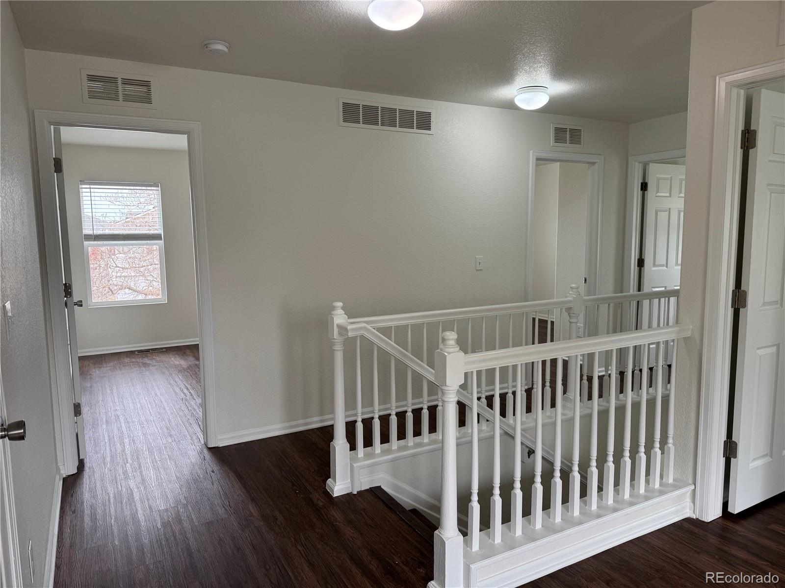 4726 Andes Street Denver, CO 80249 - Photo 7 of 17 a view of entryway with wooden floor