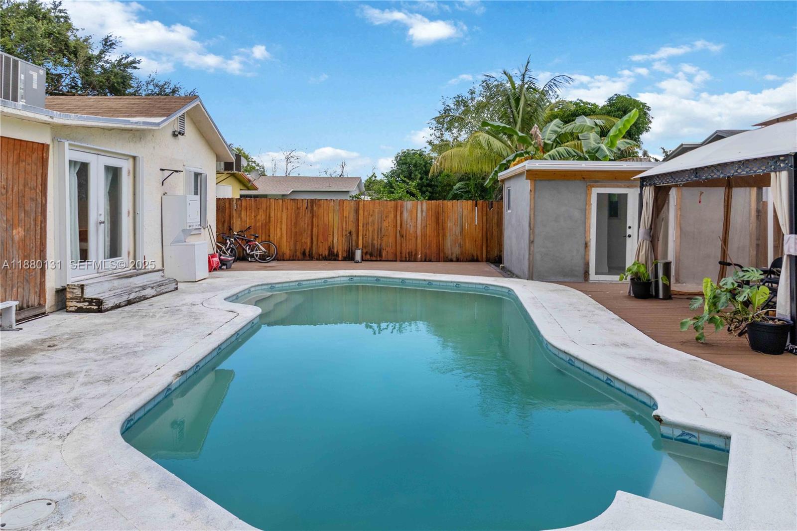 a view of a backyard with a garden and plants