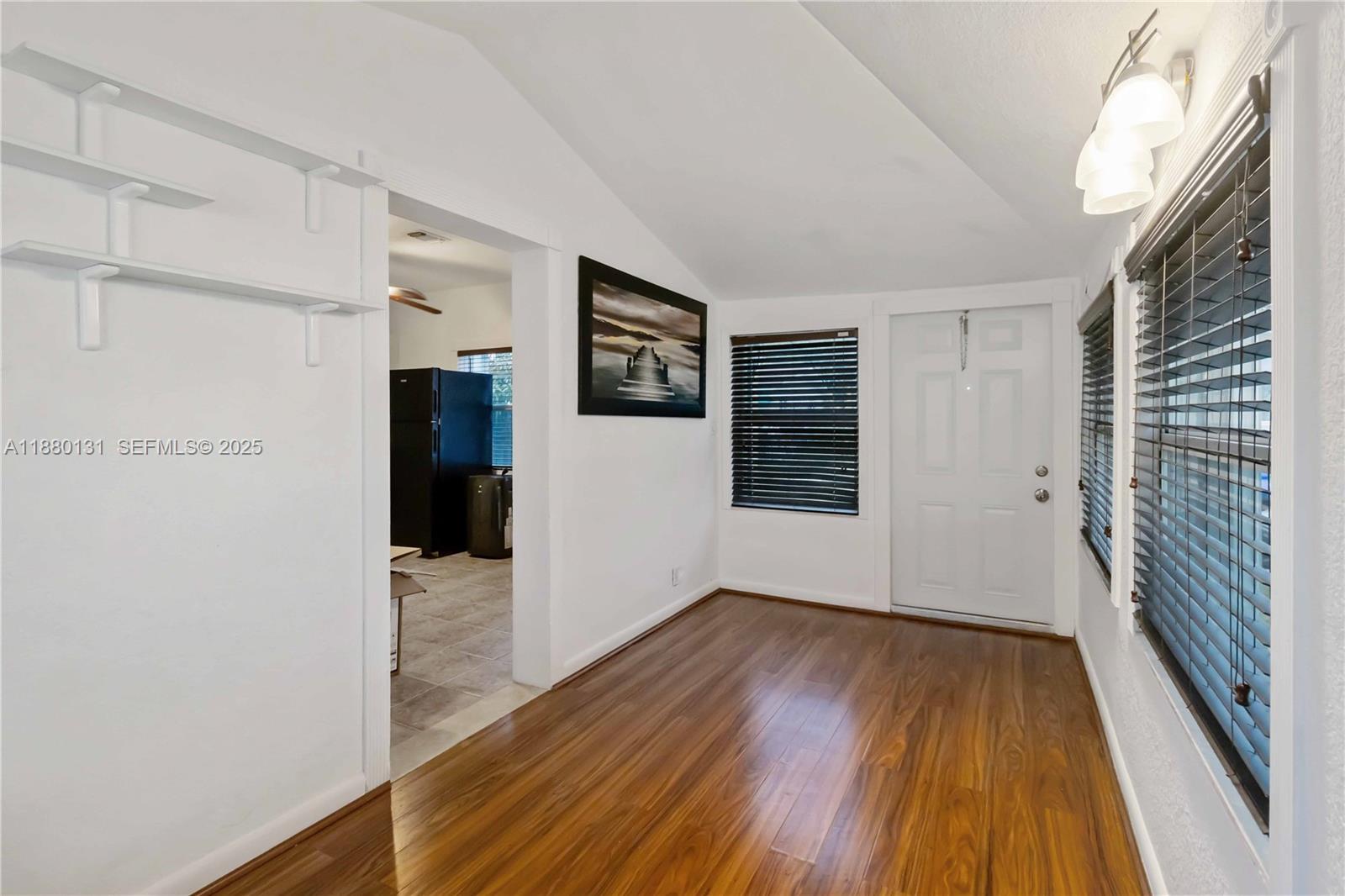 5740 Lincoln Street Hollywood, FL 33021 - Photo 12 of 28 a view of a hallway with wooden floor and staircase
