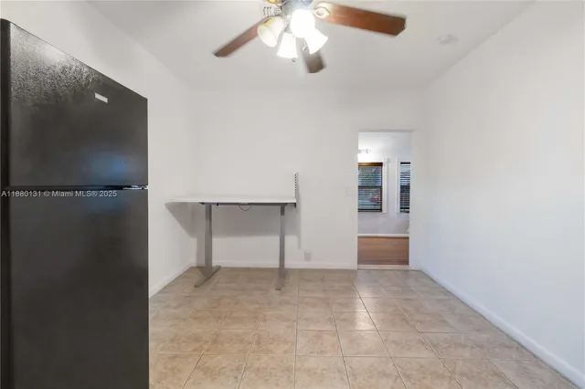 an empty room with closet and windows