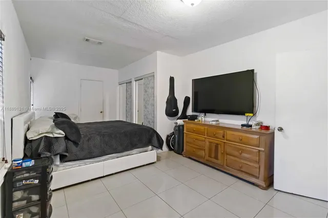 a living room with furniture and flat screen tv
