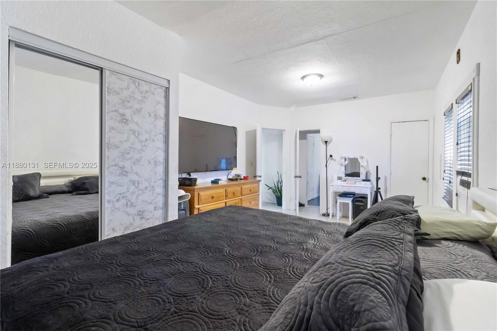 5740 Lincoln Street Hollywood, FL 33021 - Photo 20 of 28 a living room with furniture and a flat screen tv