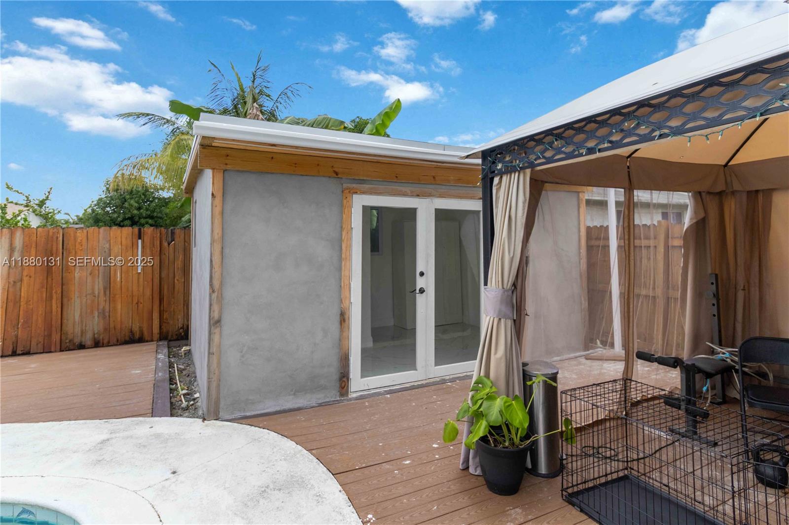 5740 Lincoln Street Hollywood, FL 33021 - Photo 24 of 28 a front view of a house with a garden