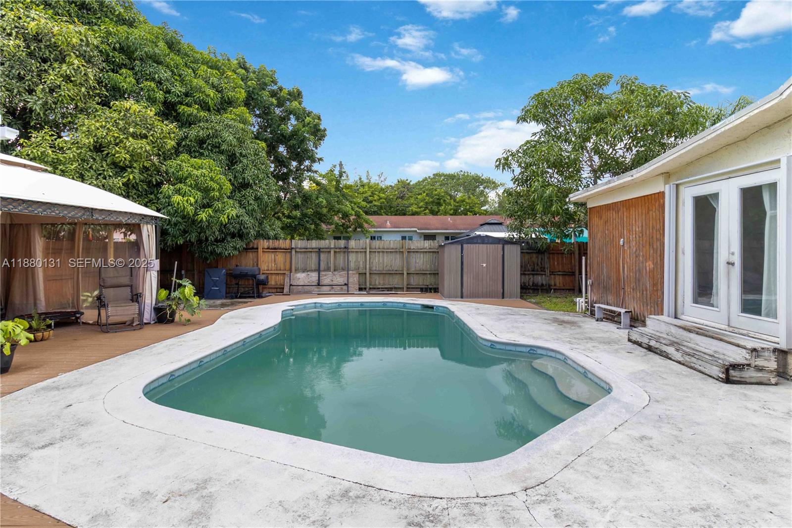 5740 Lincoln Street Hollywood, FL 33021 - Photo 25 of 28 a view of a swimming pool with a patio