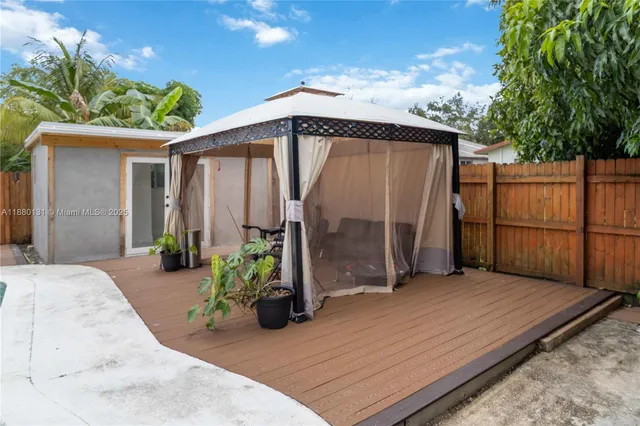 a view of a backyard with a patio