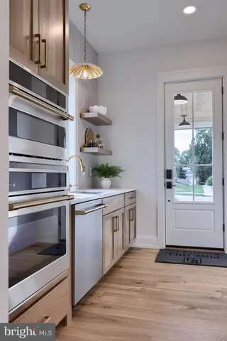 a kitchen with a stove and a microwave
