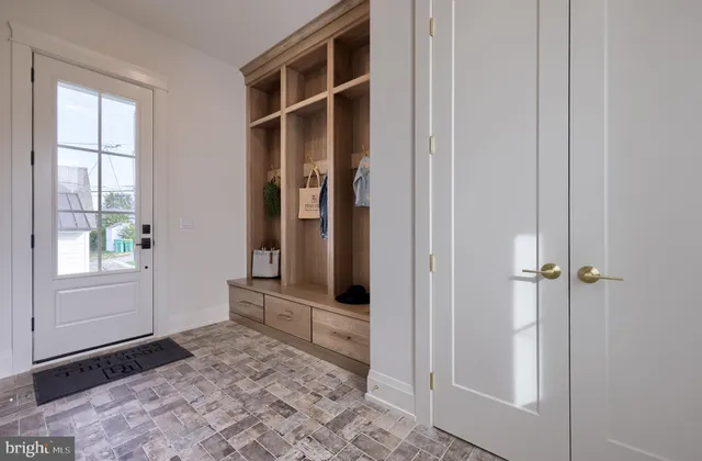 a view of front door with wooden floor