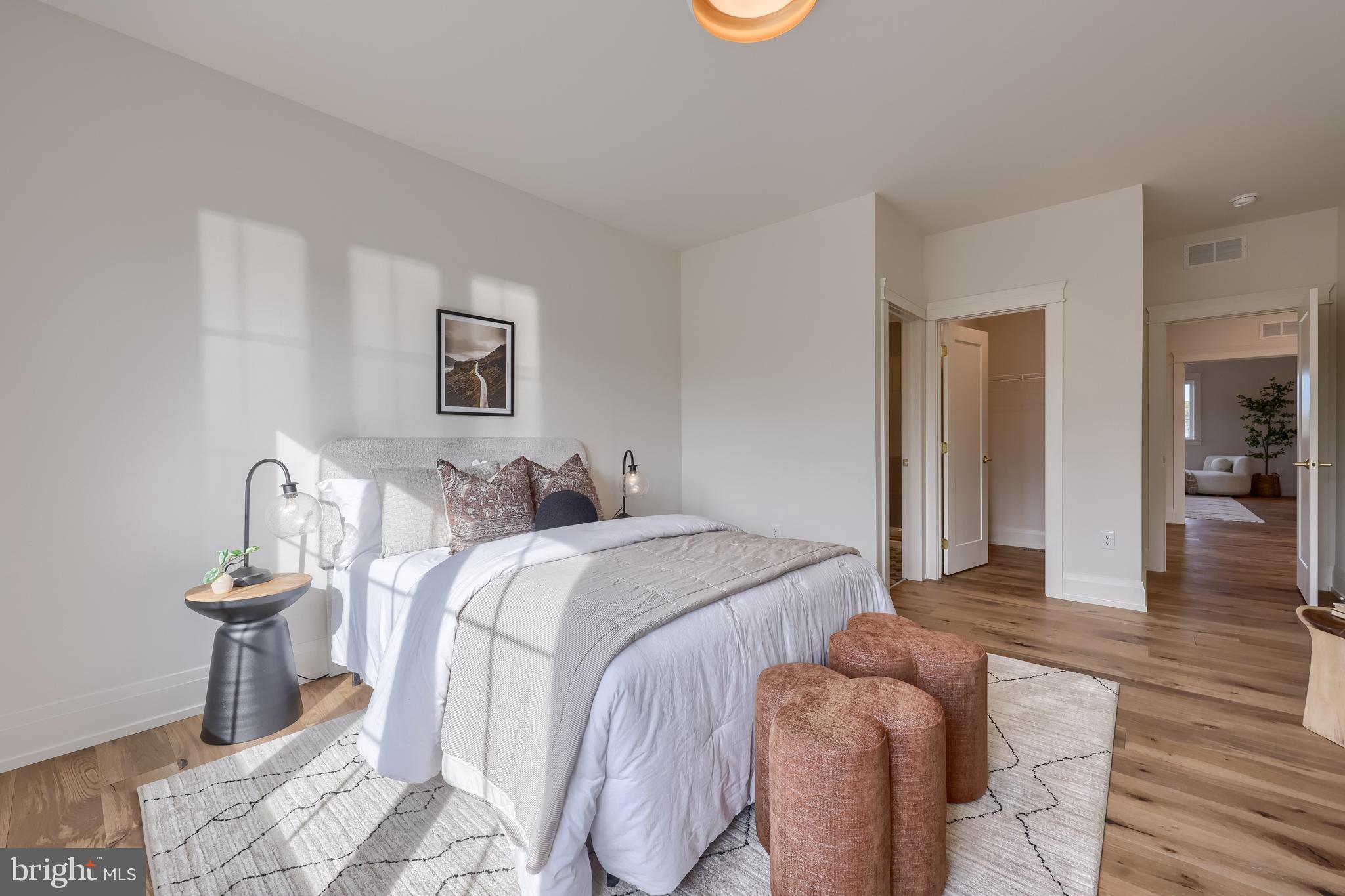 1225 Hunsicker Road Lancaster, PA 17601 - Photo 23 of 41 a spacious bedroom with a bed and wooden floor