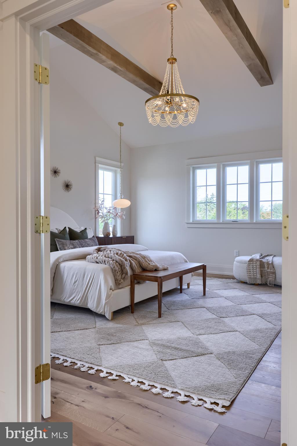 1225 Hunsicker Road Lancaster, PA 17601 - Photo 26 of 41 a bedroom with a bed and a chandelier