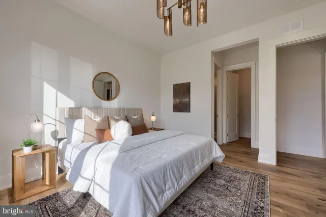 a bedroom with bed and a window