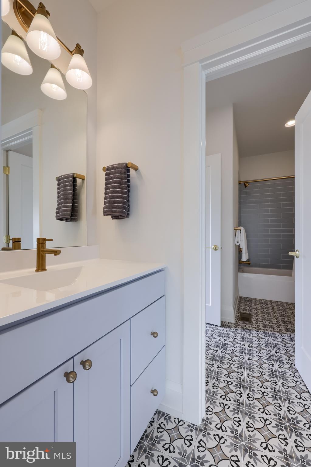 1225 Hunsicker Road Lancaster, PA 17601 - Photo 40 of 41 a bathroom with a sink a toilet and a mirror