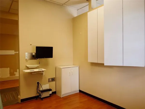 a view of a livingroom with furniture and a flat screen tv