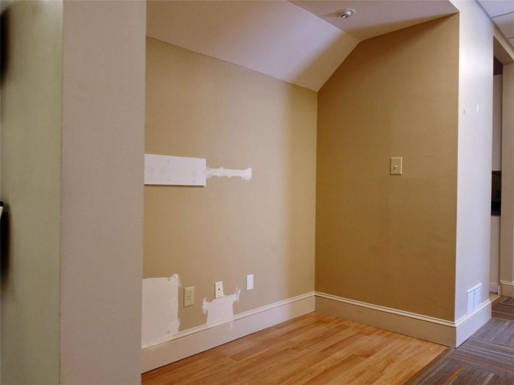 3218 Mill Street Northeast Covington, GA 30014 - Photo 13 of 69 a view of an empty room with wooden floor