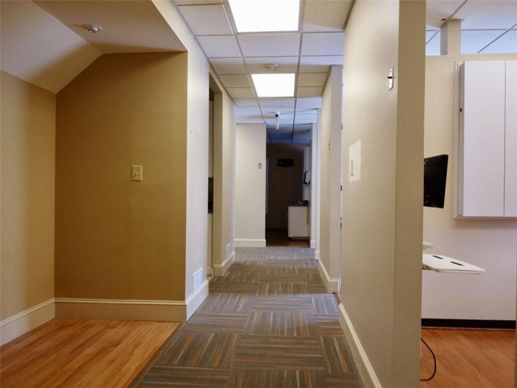 3218 Mill Street Northeast Covington, GA 30014 - Photo 14 of 69 a view of a hallway with wooden floor and a bathroom