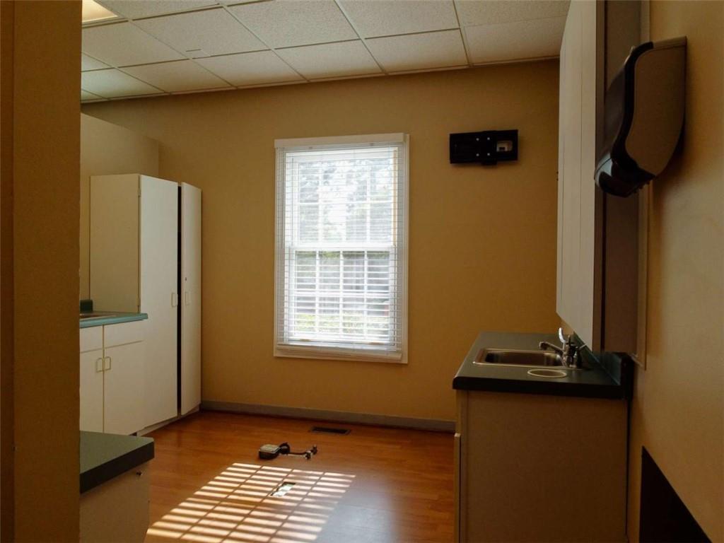 3218 Mill Street Northeast Covington, GA 30014 - Photo 16 of 69 a view of a livingroom with wooden floor and a window