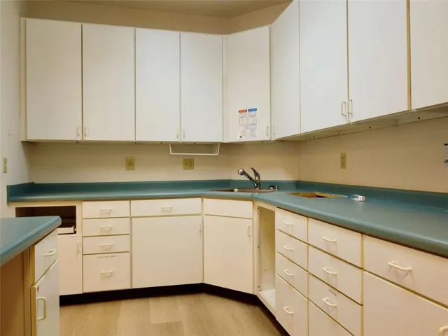 a room with a wooden floor and a table