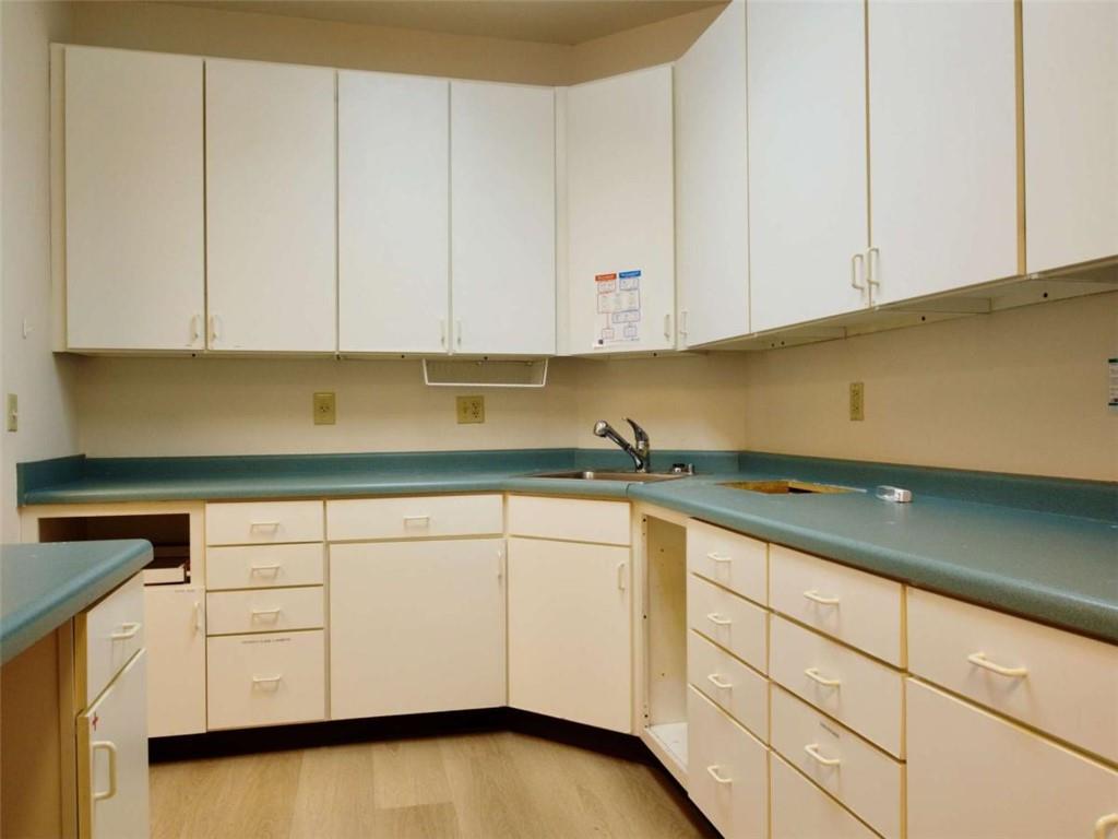3218 Mill Street Northeast Covington, GA 30014 - Photo 17 of 69 a kitchen with granite countertop white cabinets and white appliances