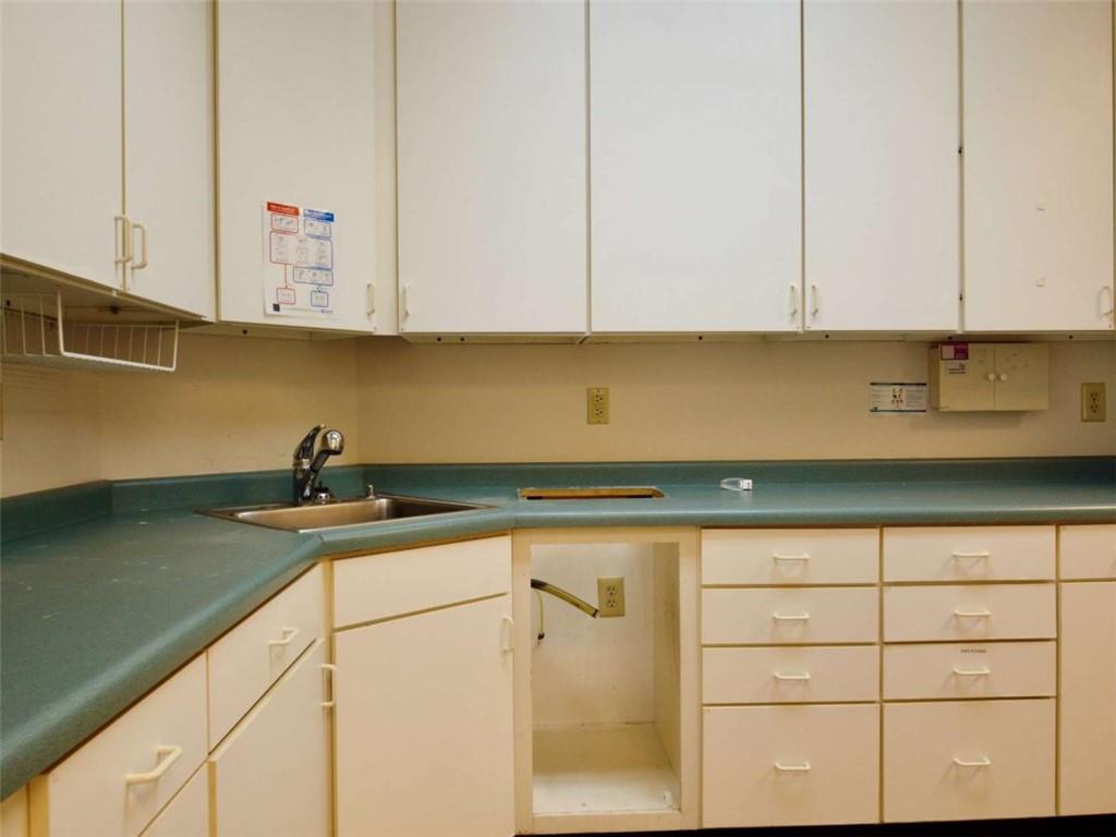 3218 Mill Street Northeast Covington, GA 30014 - Photo 18 of 69 a kitchen with stainless steel appliances granite countertop a sink a stove and dishwasher