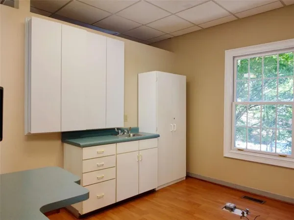 a kitchen with stainless steel appliances granite countertop a stove a sink and a window