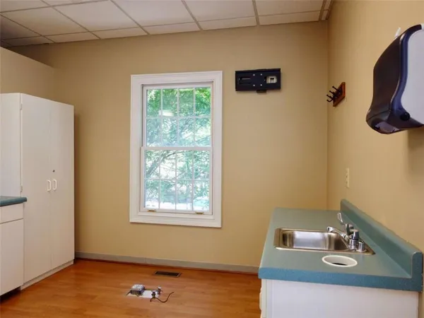 a kitchen with a white cabinets and a stove