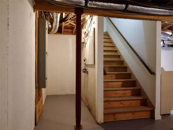 a view of a house with a yard and sitting area