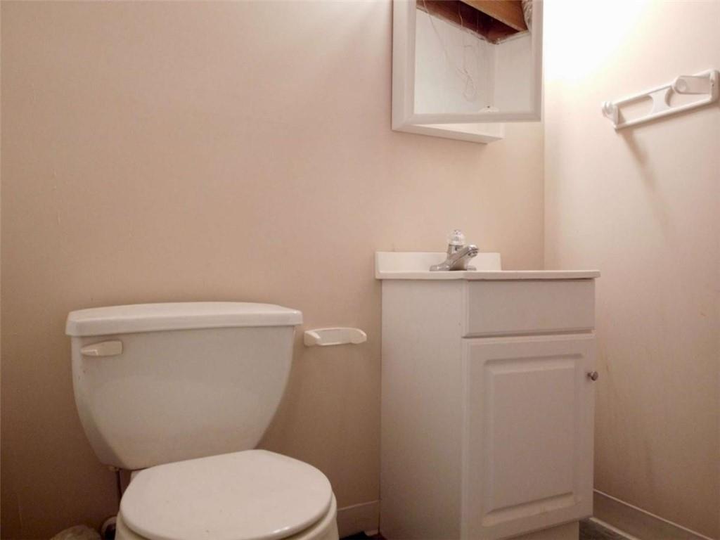 3218 Mill Street Northeast Covington, GA 30014 - Photo 51 of 69 a white toilet sitting next to a sink