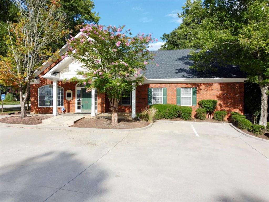 3218 Mill Street Northeast Covington, GA 30014 - Photo 62 of 69 a view of a building with cars parked on road