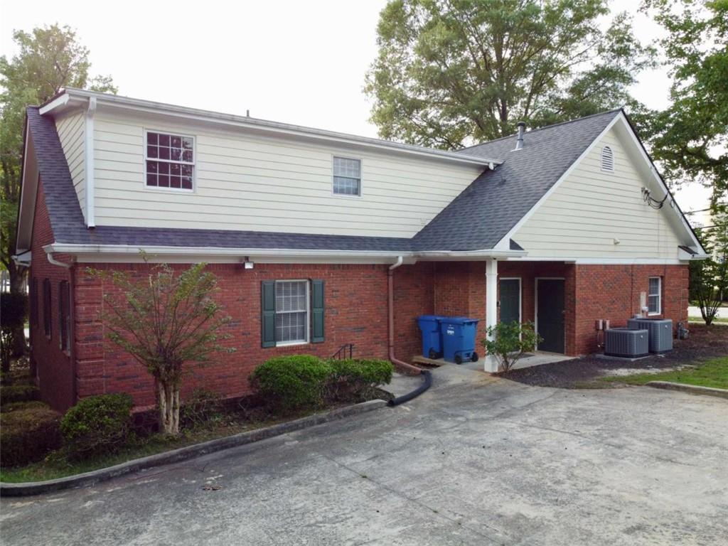 3218 Mill Street Northeast Covington, GA 30014 - Photo 68 of 69 a front view of a house with a yard and outdoor seating